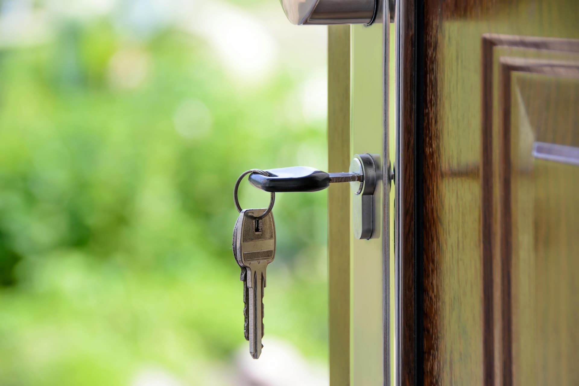 Smart lock next to a traditional deadbolt